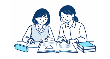 学校の教材を一緒に開いて学ぶ生徒